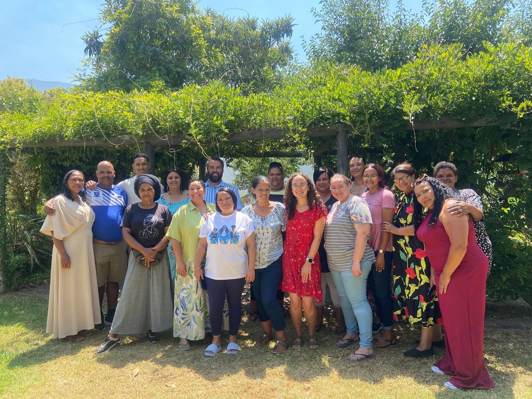 A group of adults from the Greyton Primary School community, photographed together outdoors
